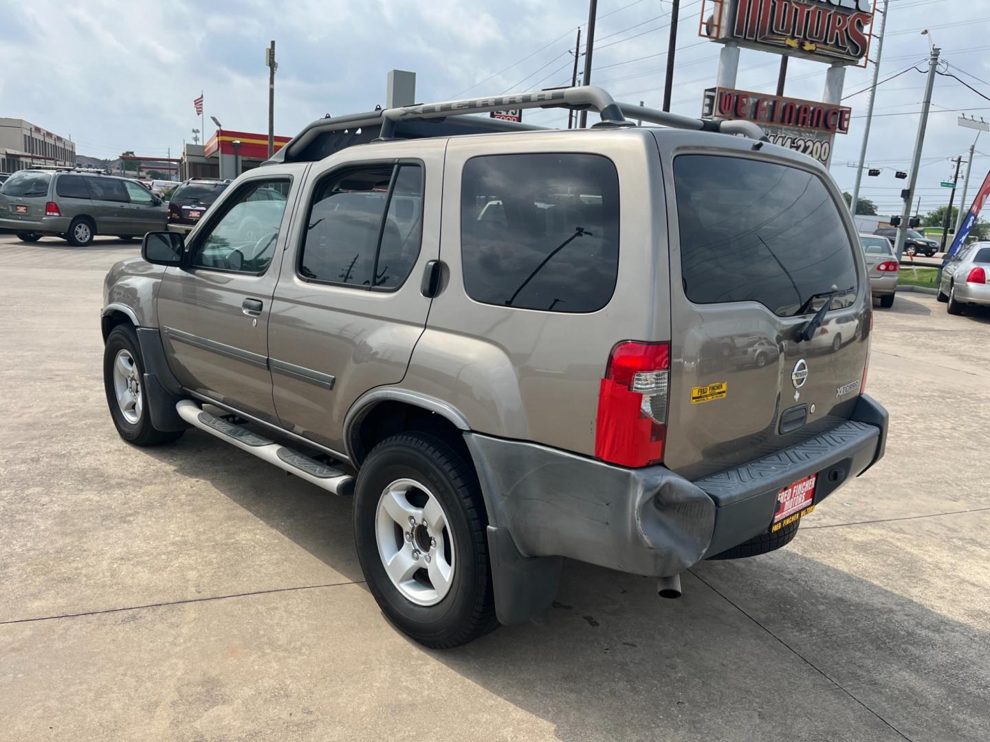 2004 GOLD /gray Nissan Xterra (5N1ED28T84C) , Automatic transmission, located at 14700 Tomball Parkway 249, Houston, TX, 77086, (281) 444-2200, 29.928619, -95.504074 - Photo#4